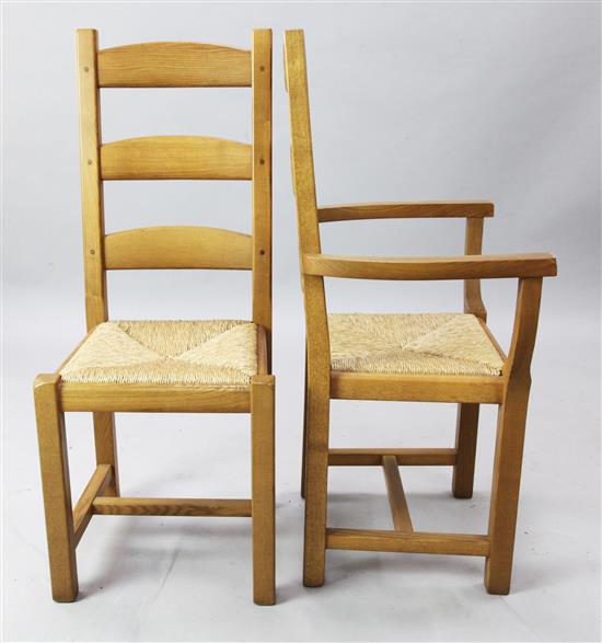 A set of fourteen oak ladderback dining chairs, H.3ft 8in.